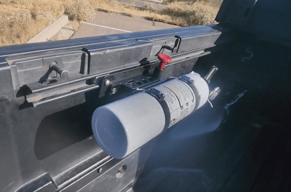 fire extinguisher mounted in truck bed