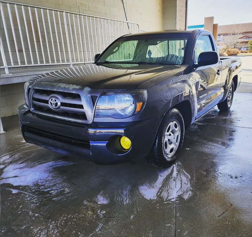 lowered grey toyota tacoma at car wash