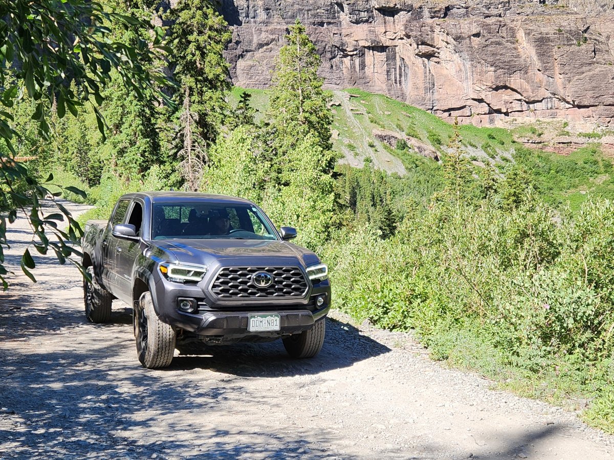 toyota tacoma driving on off-roading trail
