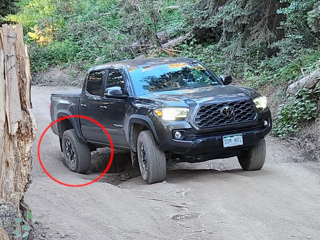 toyota tacoma driving through a ditch