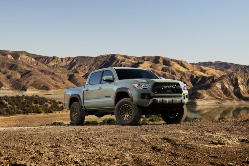 lunar rock toyota tacoma with mountains in background