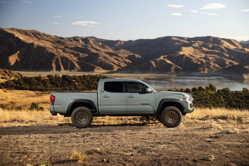 lunar rock toyota tacoma with mountains in background right side view